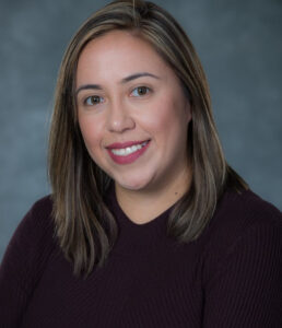 Portrait photo of A Morales, medical assisting professional, woman smiling in portrait photo
